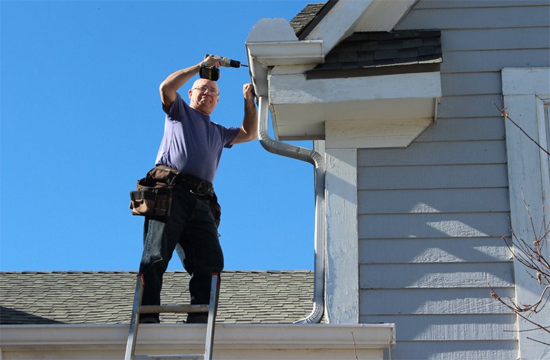 A person standing on a ladder

Description automatically generated with low confidence